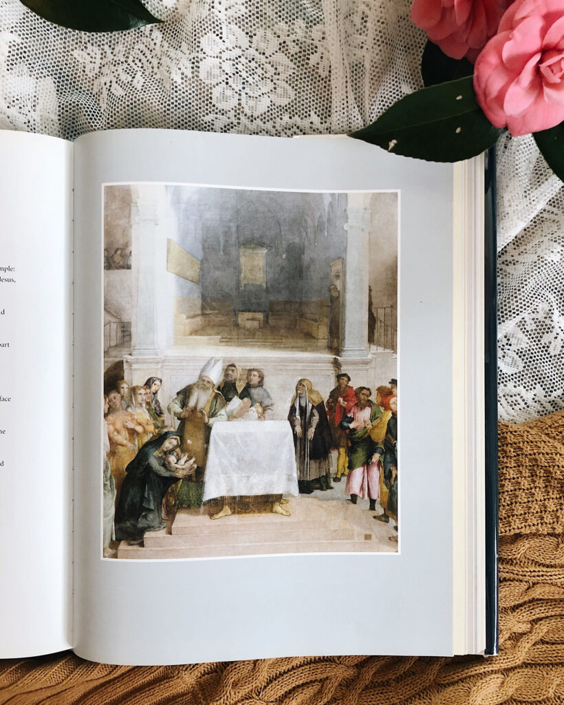 Illustration of a nativity scene inside a church-like hall, with a baby in a cradle at a table and a crowd of onlookers surrounding them.