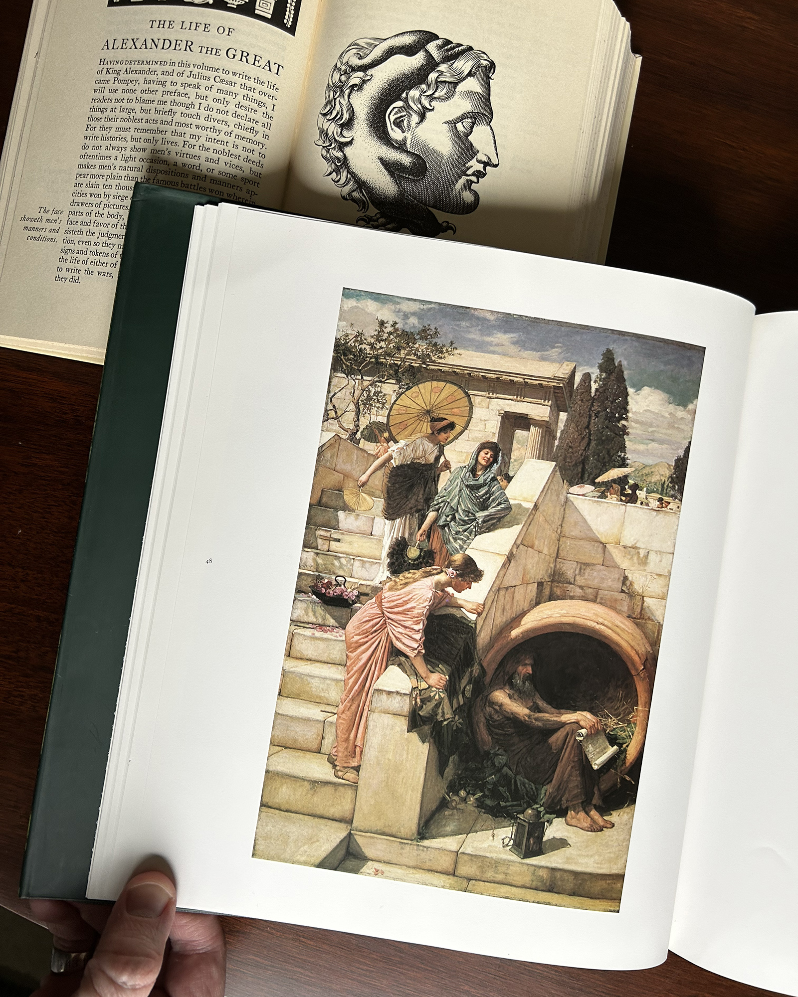 Color illustration of several women in a classical courtyard near a stone well and steps, embedded in a book page