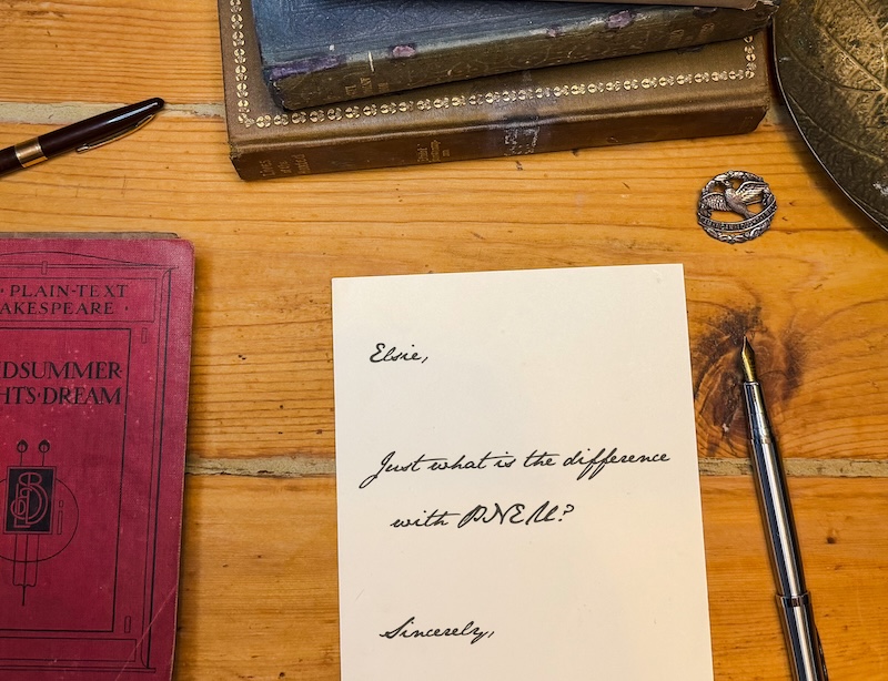 Handwritten letter on a wooden desk, addressed to Elsie, reading 'Just what is the difference with PNE?' beside a fountain pen.